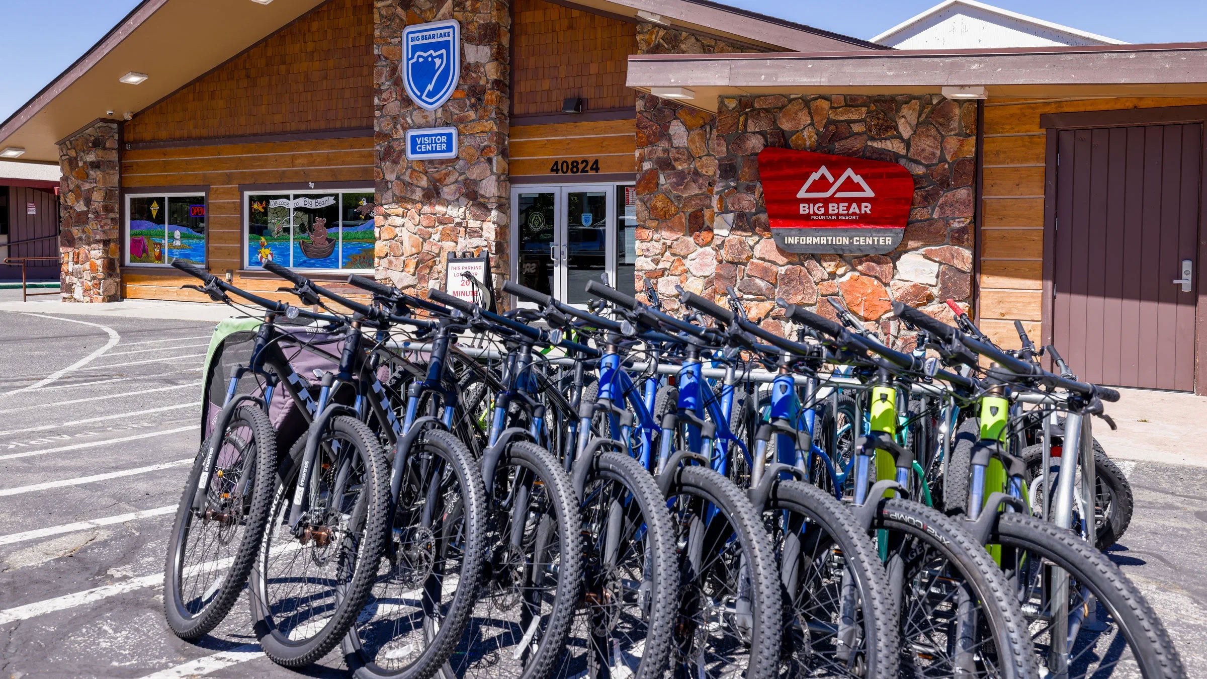Big Bear Lake's Visitors Center Station during summer with rental bikes in front of storefront