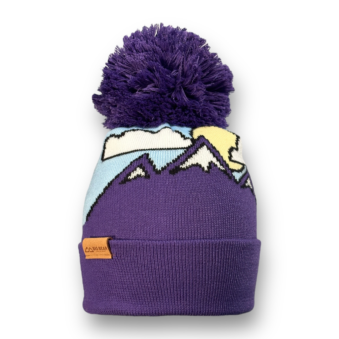 Beanie with snow capped purple mountains, clouds and a sun on a blue sky with purple pom pom and BBMR Logo tag on cuff of beanie.