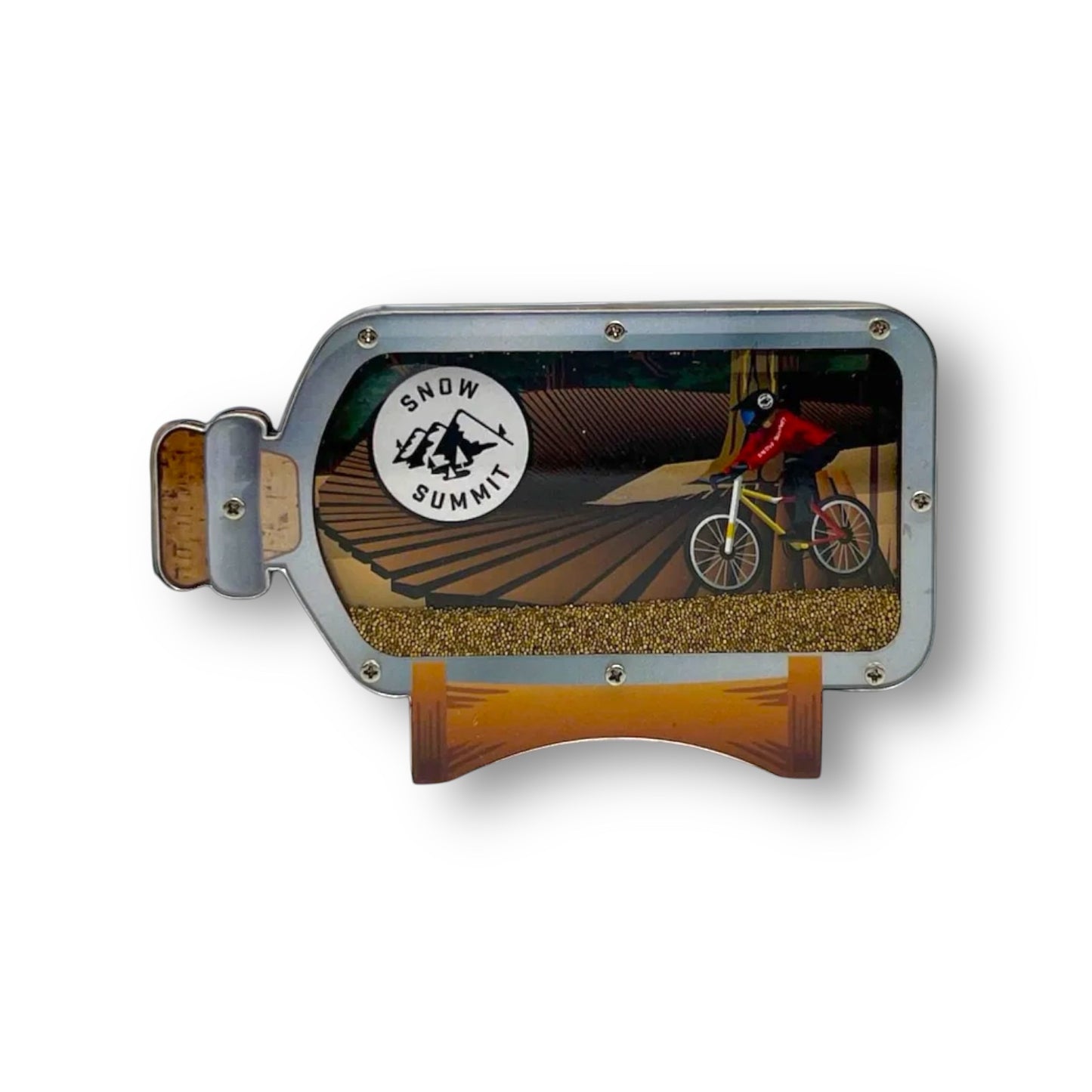 A magnet with a mountain biker in a bottle