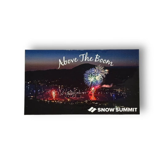 Above the Boom sticker of Big Bear Lake's annual 4th of July firework spectacular, Above the Boom, with an arial view of fireworks in the sky over the lake. On the bottom right corner, white Snow Summit logo.