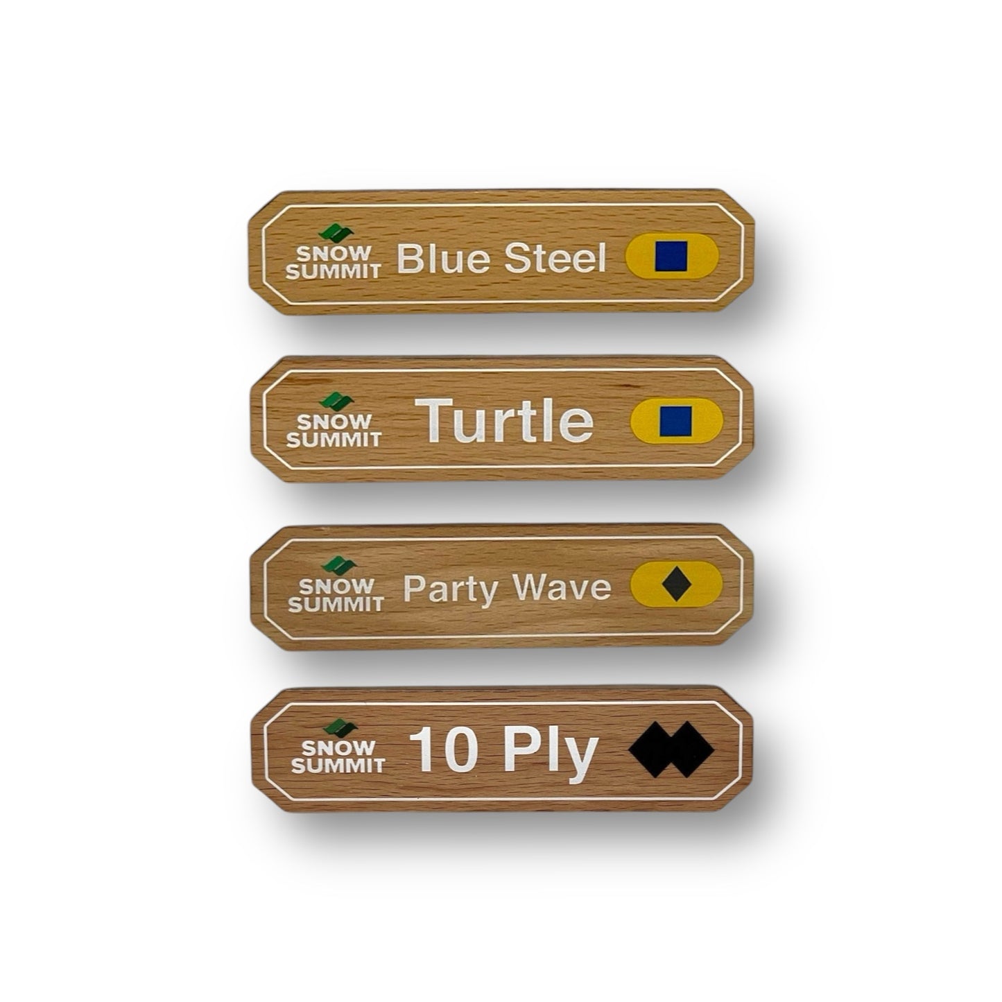 Wooden magnets with a Snow Summit logo on the left and trail signs for: Blue Steel, Turtle, Party Wave, and 10 Ply copy on it with difficulty legend rating