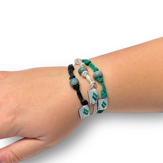 Eco-friendly hemp bracelets. Green, tan, and black colored with bead and snow summit logo