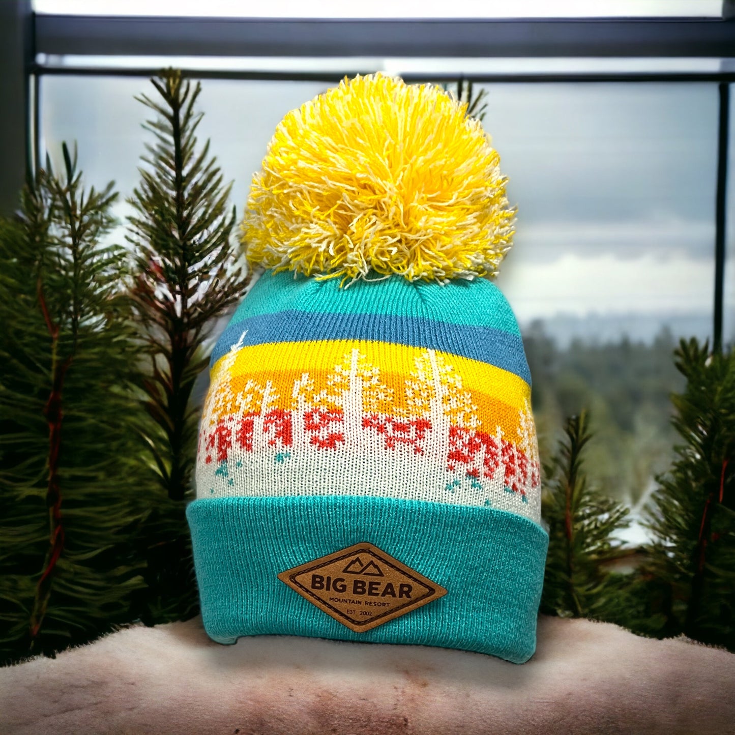 Mixed yellow & blue pattern throughout the beanie w/ trees with Big Bear Mountain Resort leather patch.
