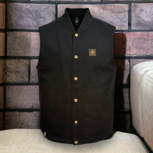 Black button up vest with two large pockets on each side and a brown bear mountain patch on upper left side