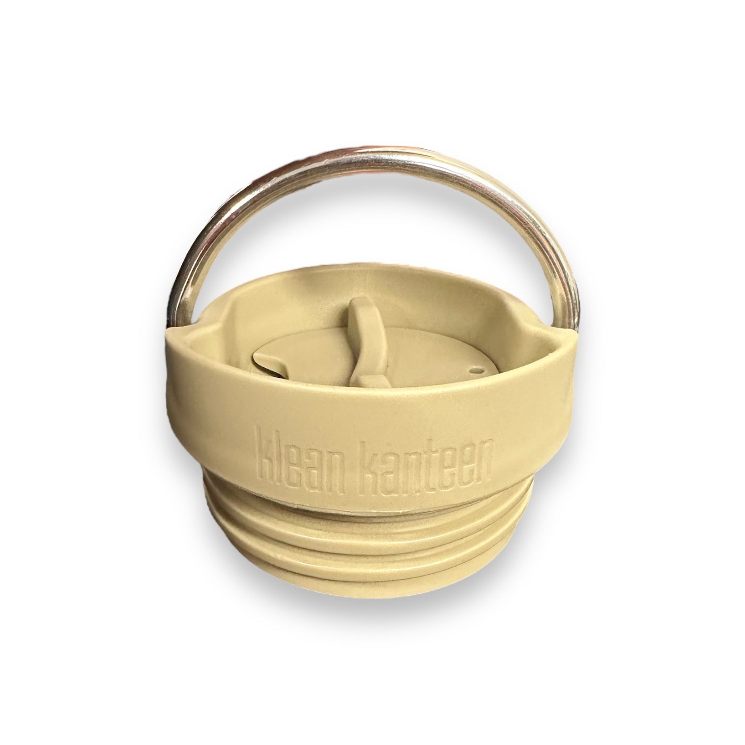 A tan twist off Klean Kanteen water bottle lid with a metal ring to carry that swivels over the top