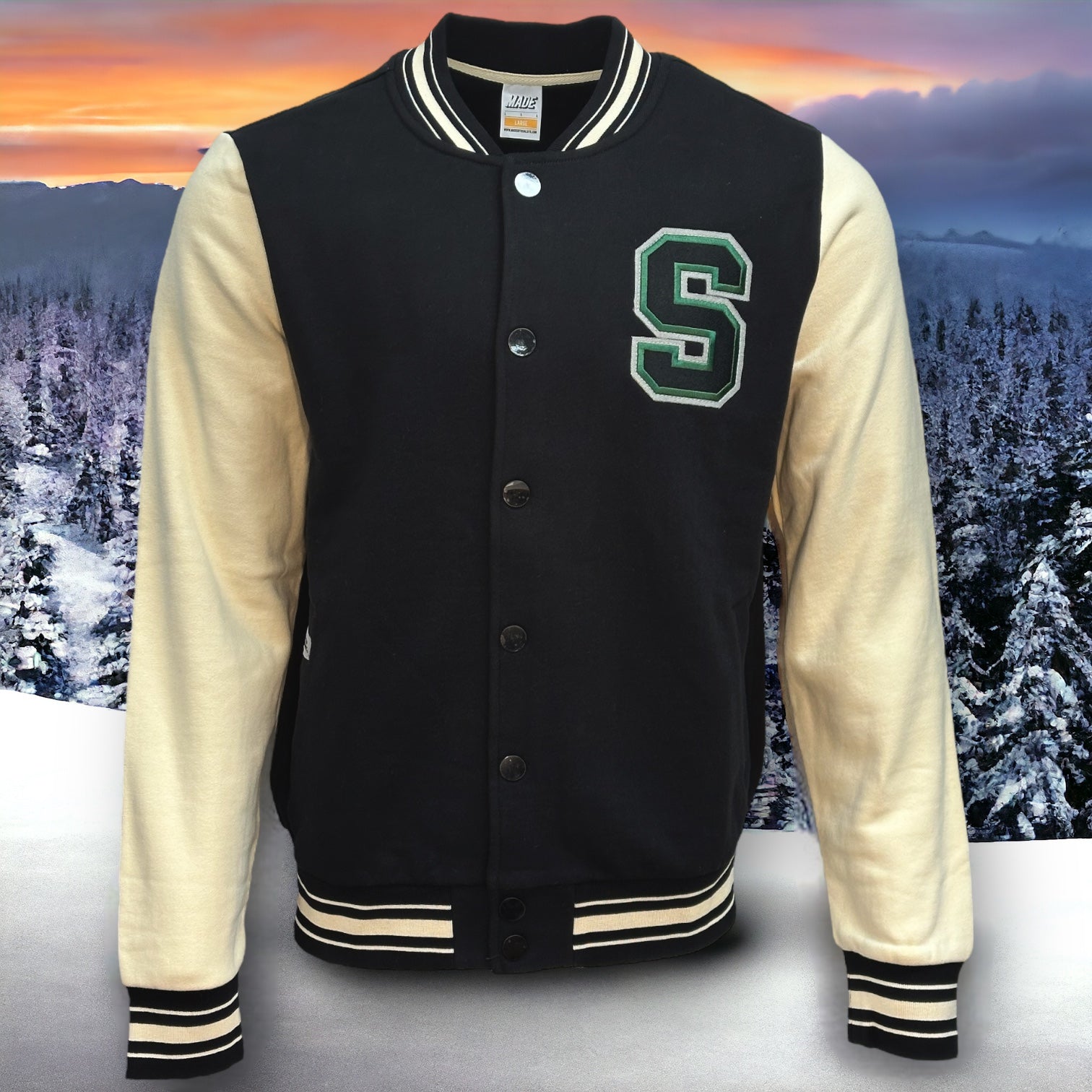 Front view of black letterman jacket with almond colored sleeves and a stitched letter S in black with green and white border