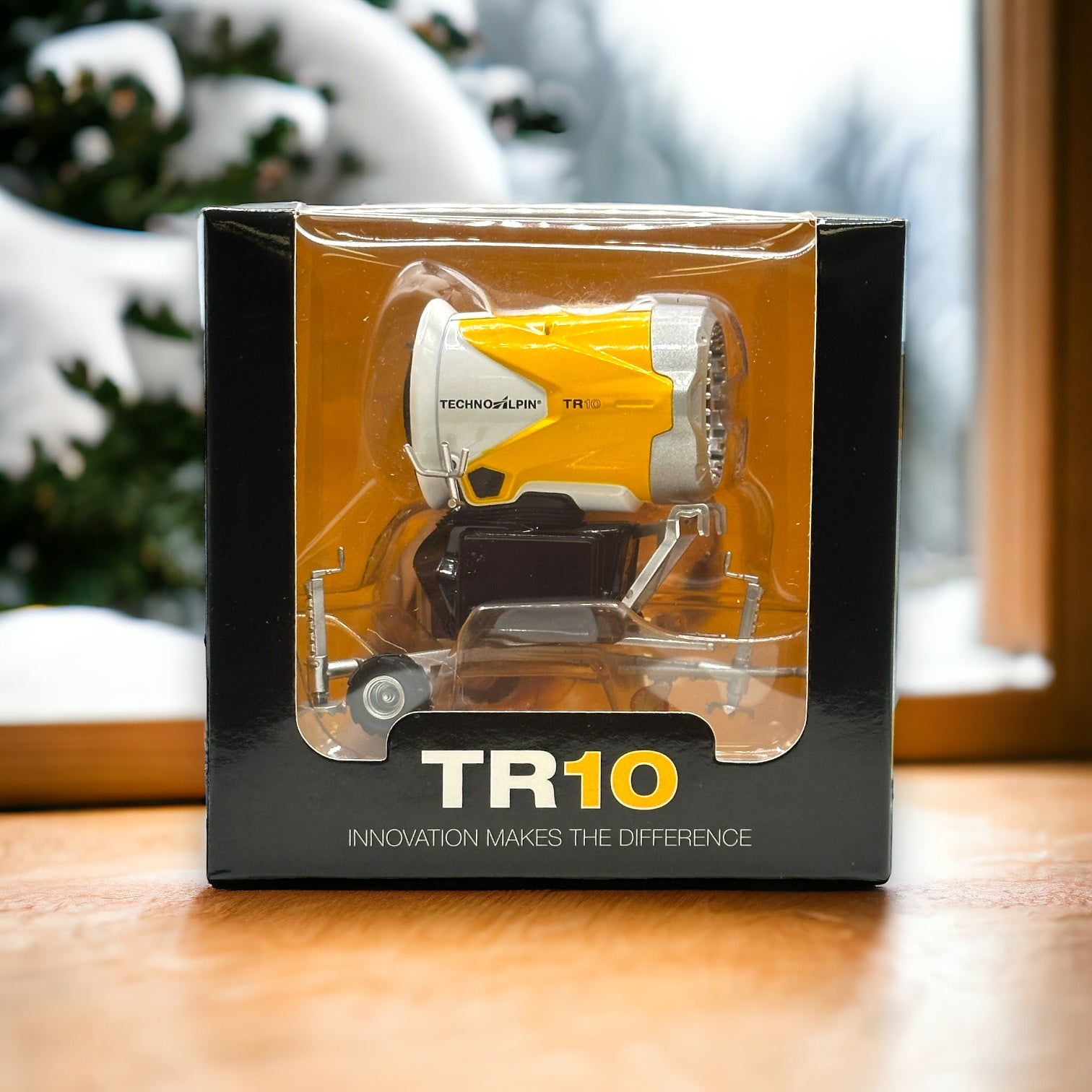 TR10 Techno Alpin snow blower machine model toy in diecast metal and plastic with black base and white and yellow snow gun colorway