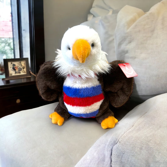 Stuffed eagle animal with red, white, and blue belly.