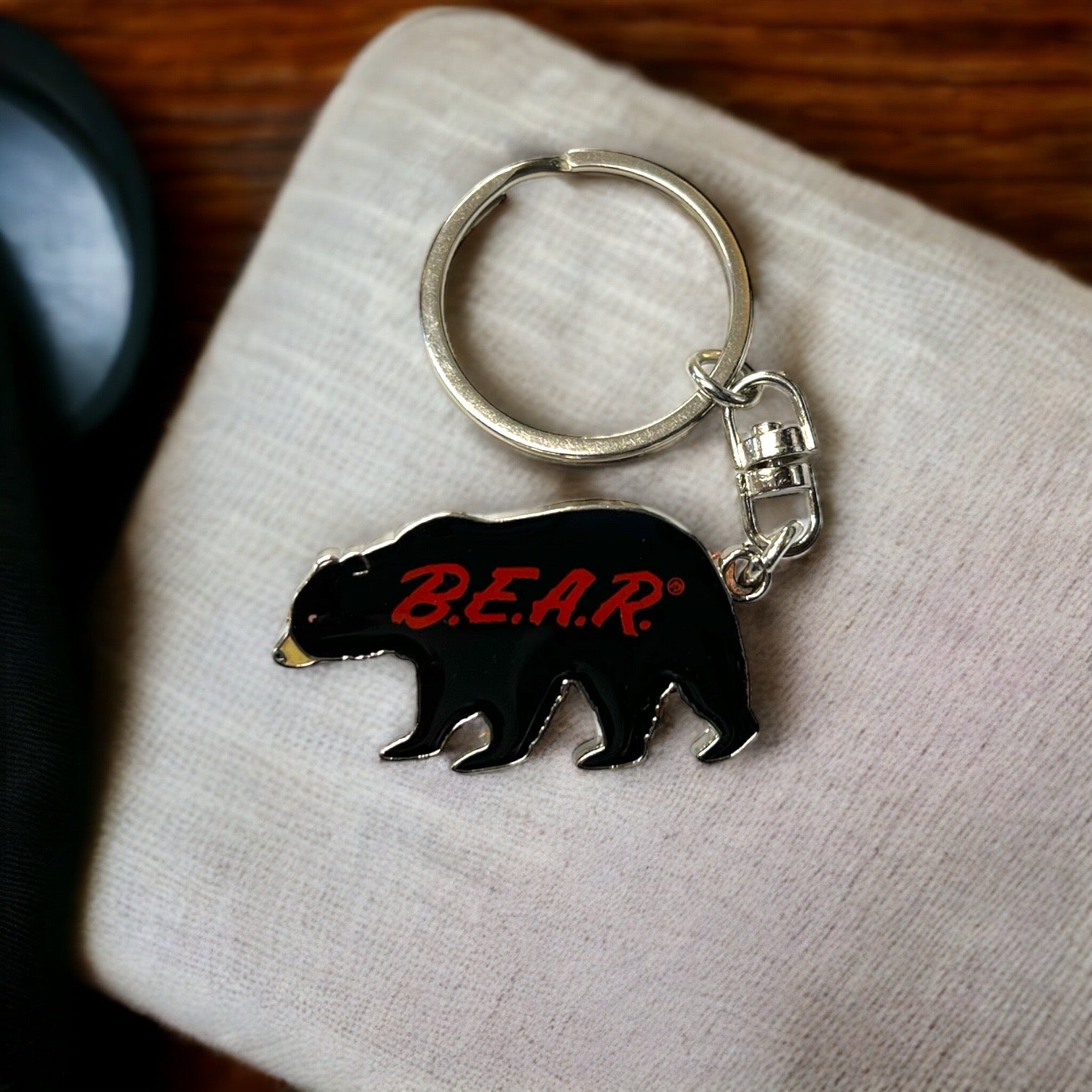 •	B.E.A.R. Black bear keychain bottle opener