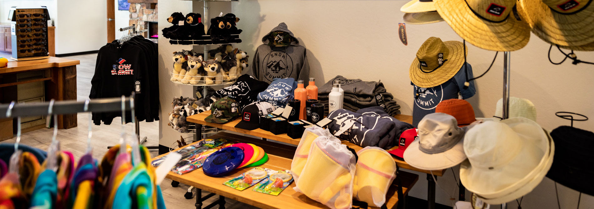 BBMR Visitor's Center Station retail floor with products displayed on racks, table, and product holders