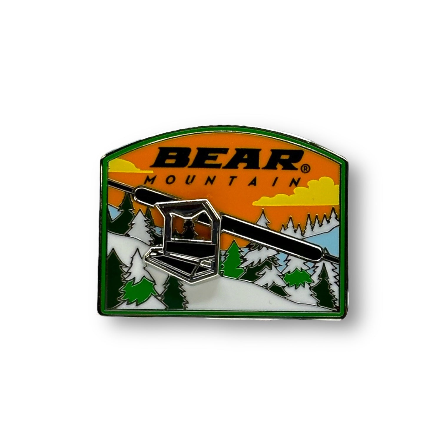 Bear Mountain moving chairlift metal pin with a mountain scenery with green pine trees and a orange sky with white clouds