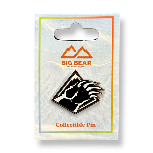 Collectible black and white Bear Mountain bear claw pin in Big Bear Mountain Resort packaging.
