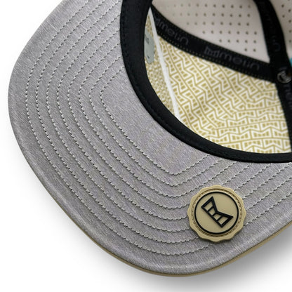 The underside of a Melin brand hat with the thumbprint undervisor seal.