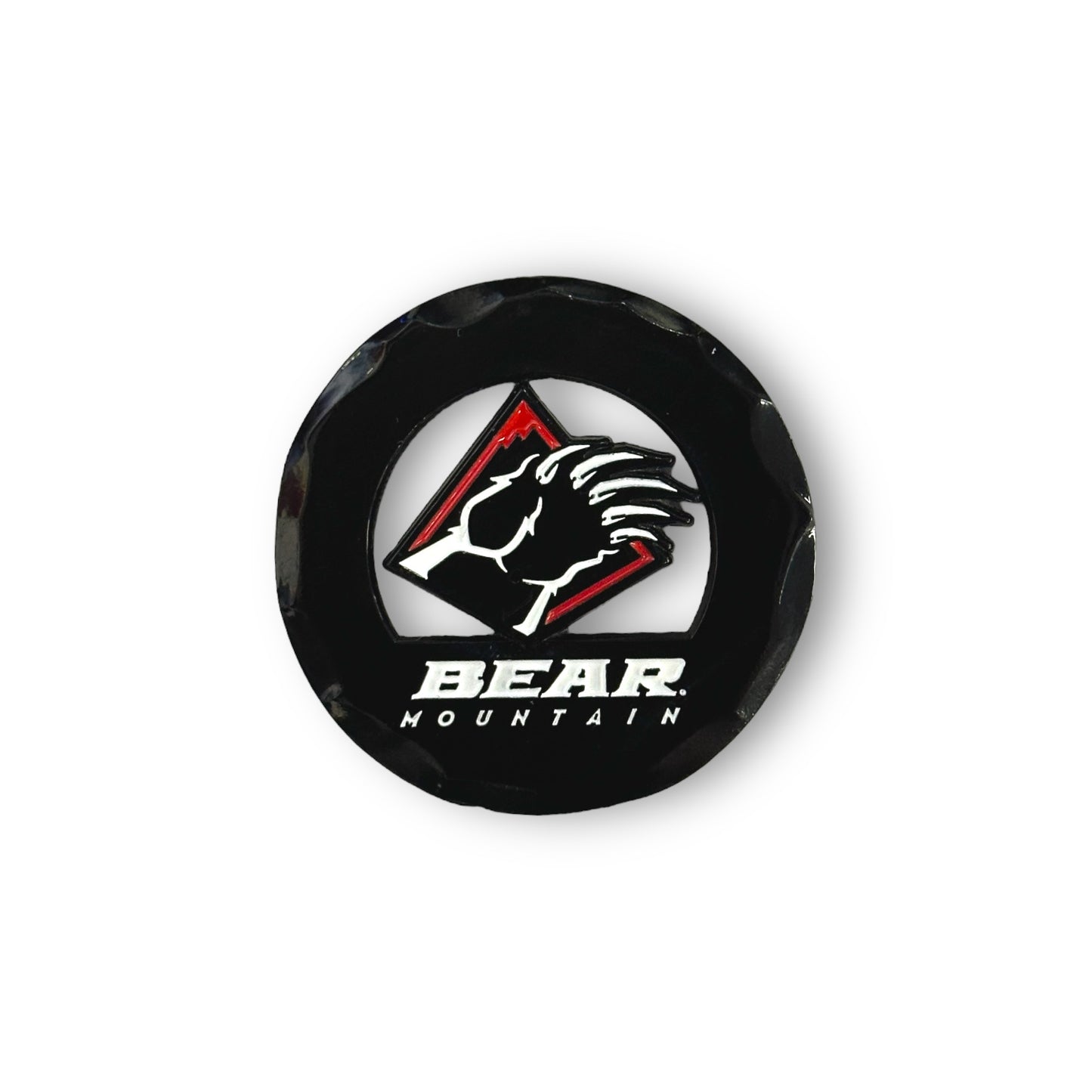 Black circular golf ball marker with the Bear Mountain bear claw logo in red and white.
