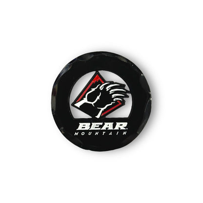 Black circular golf ball marker with the Bear Mountain bear claw logo in red and white.