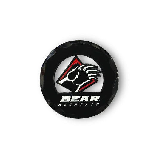 Black circular golf ball marker with the Bear Mountain bear claw logo in red and white.