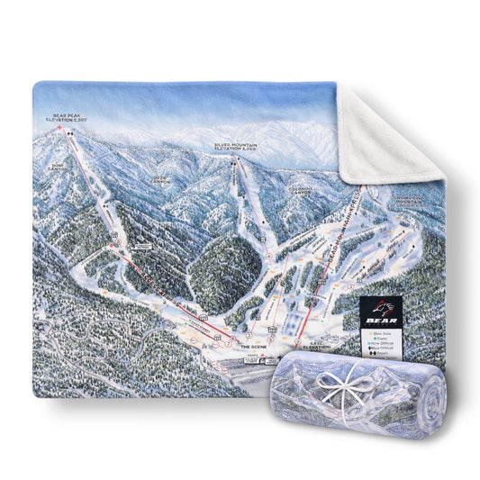 A blanket with Bear Mountain's winter trail map on one side, with an opposing blank white side.