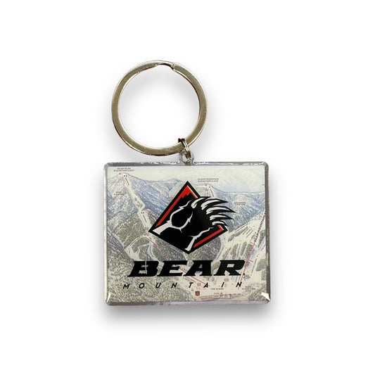 Bear Mountain winter trail maps keychain with trail map in background and bear claw logo in red, black, and white overlay