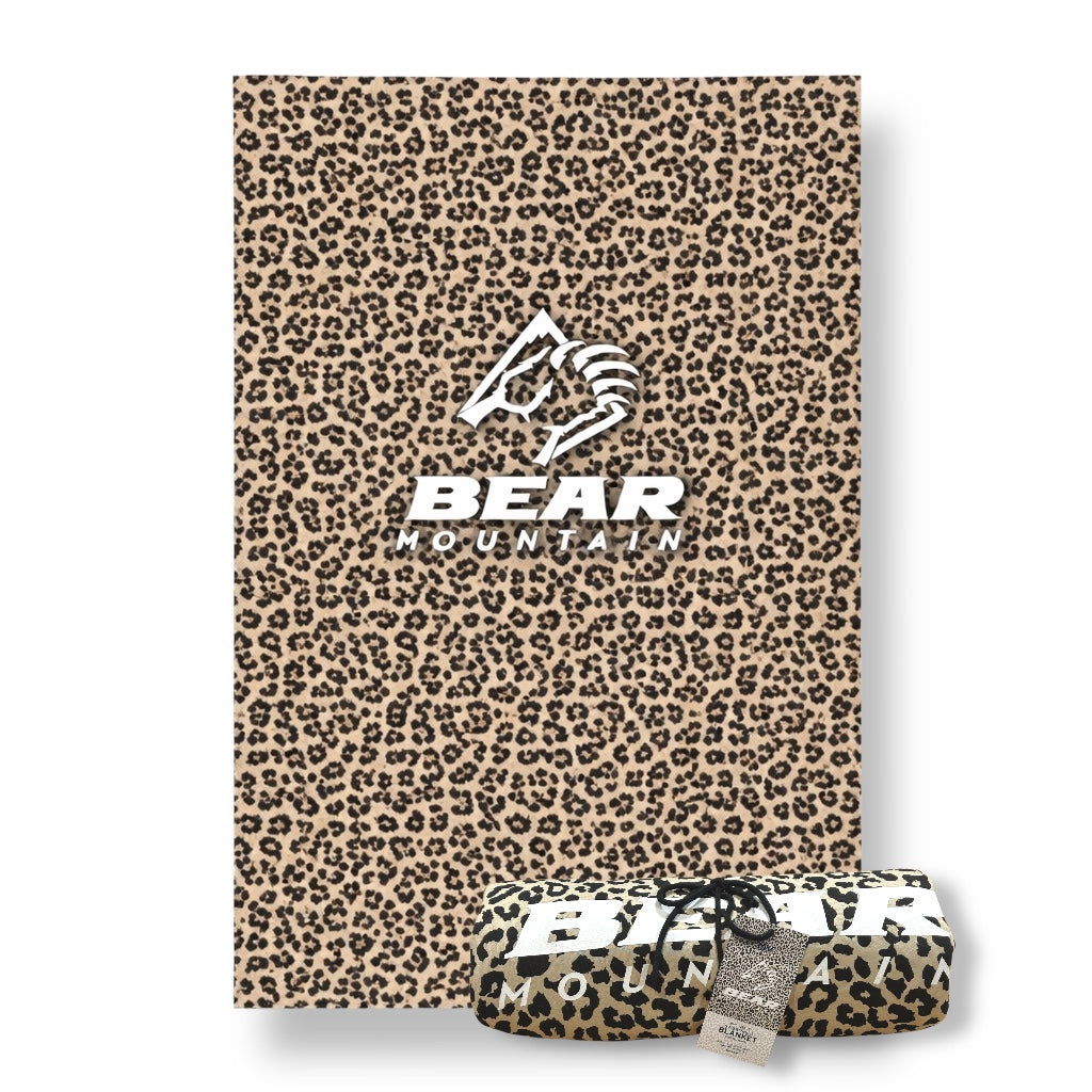 Cheetah print sweatshirt blanket with Bear Mountain logo in white.