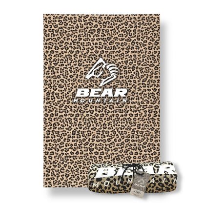 Cheetah print sweatshirt blanket with Bear Mountain logo in white.