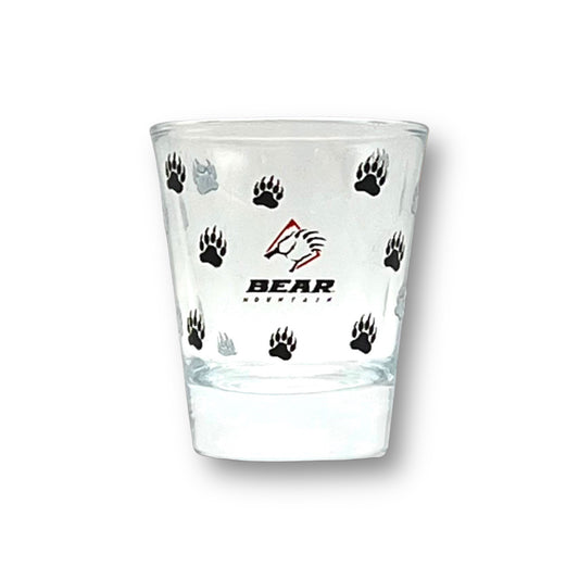 Shot glass with bear mountain logo printed around it