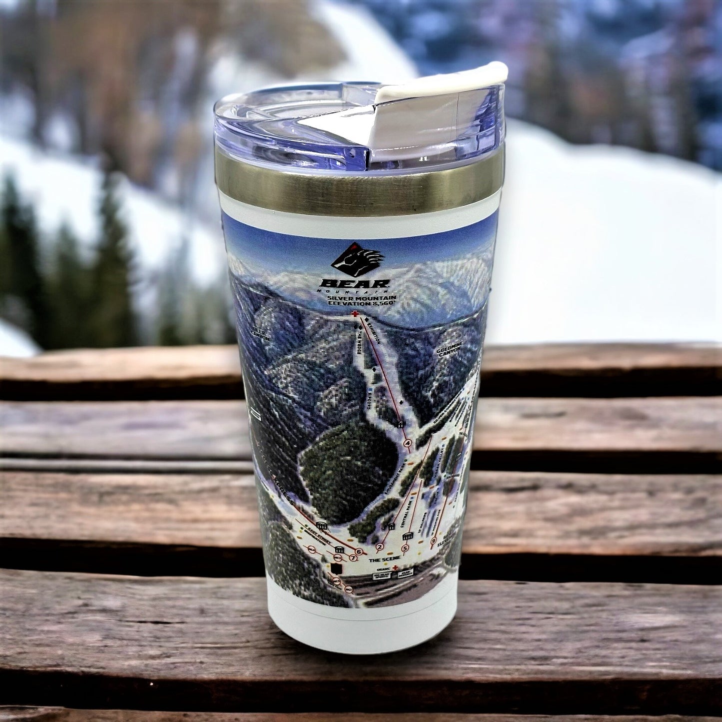 Bear Mountain winter trail map tumbler with white base and clear plastic with white flip top mouth piece for sipping.