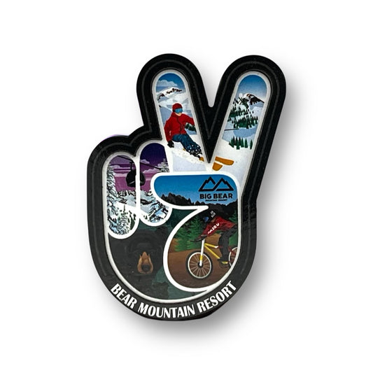 Hand peace sign shaped magnet with winter sports theme inside