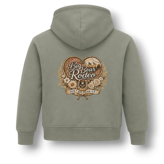 An olive green hooded sweatshirt shown from the back, featuring a large vintage-style 'Big Bear Rodeo 2026 at Bear, CA' graphic printed in the center.
