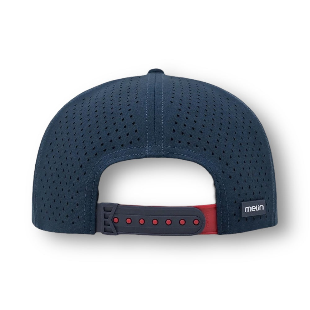 Backside of a navy blue Melin brand hat with perforated material and red accents on the snapback.