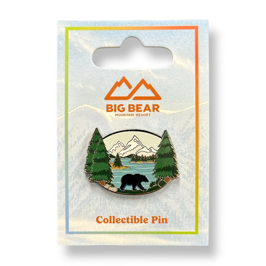 Collectible logo pin in color with white mountain peaks, green pine trees, a black bear, and blue lake.