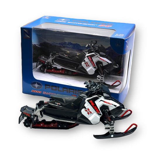A Polaris Snowmobile Toy replicating what we use on the mountain