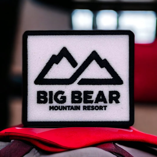 black and white patch with big bear mountain resort logo on it