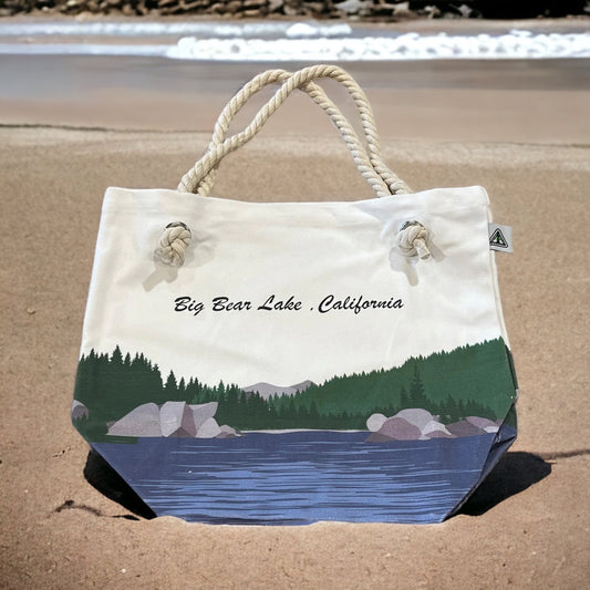 Natural color tote bag with big bear lake design with a rope handle.