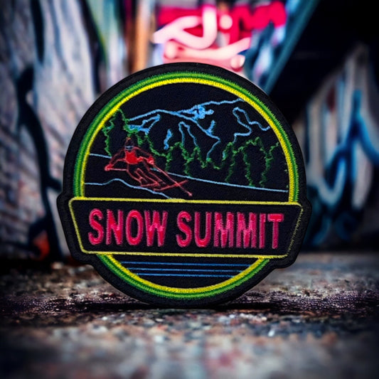 neon black and green patch with a snow summit logo on it