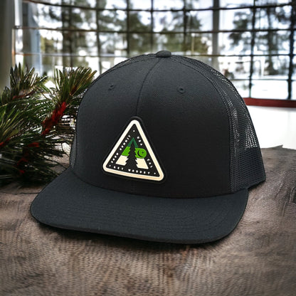 Black trucker hat with Snow Summit Woodsy logo on the front