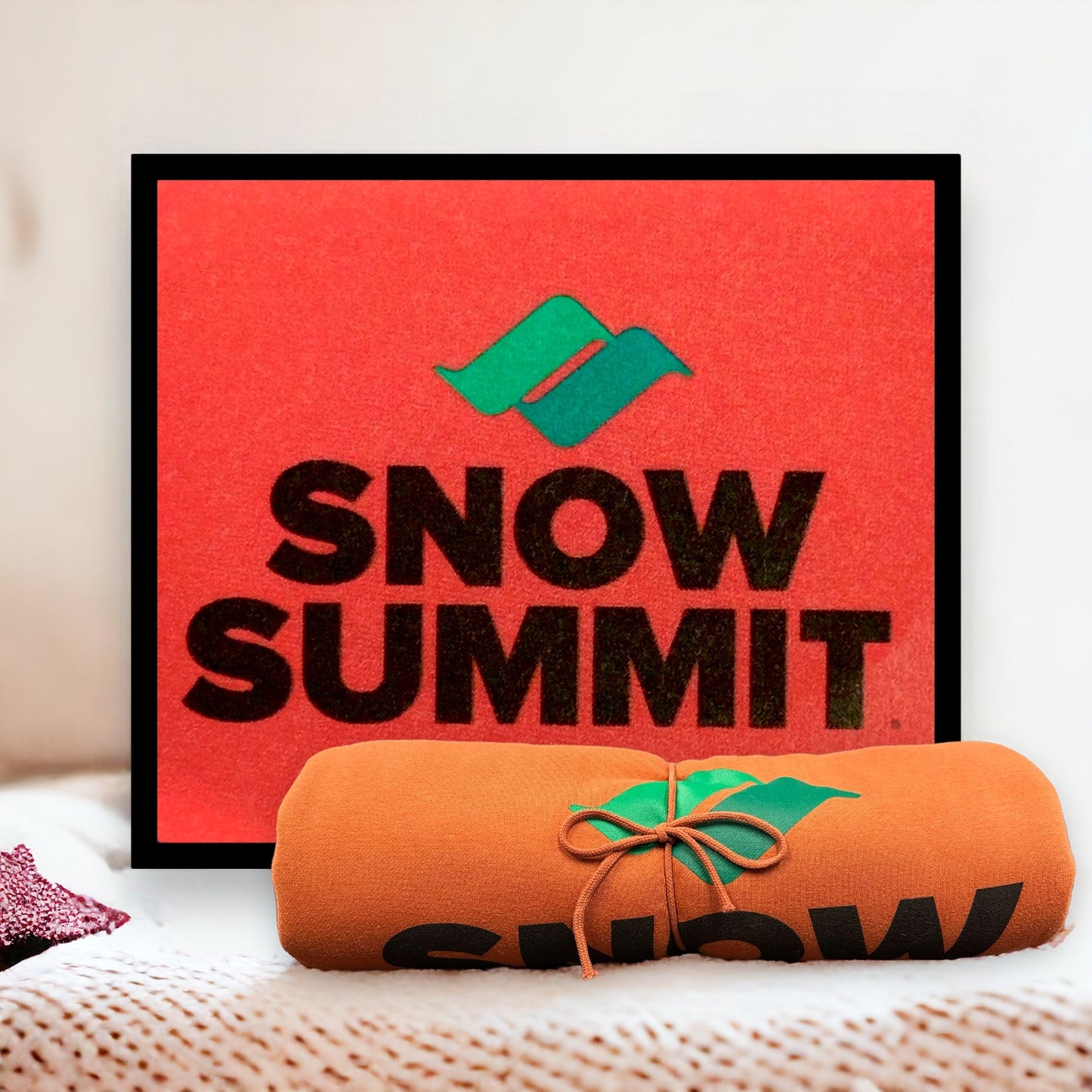 Orange blanket with Snow Summit logo in black and green