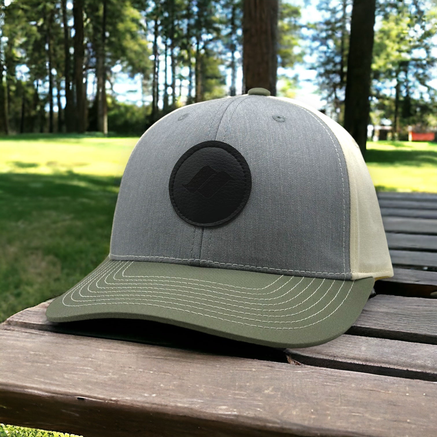Gray and green tri color snapback Snow Summit hat with black logo patch