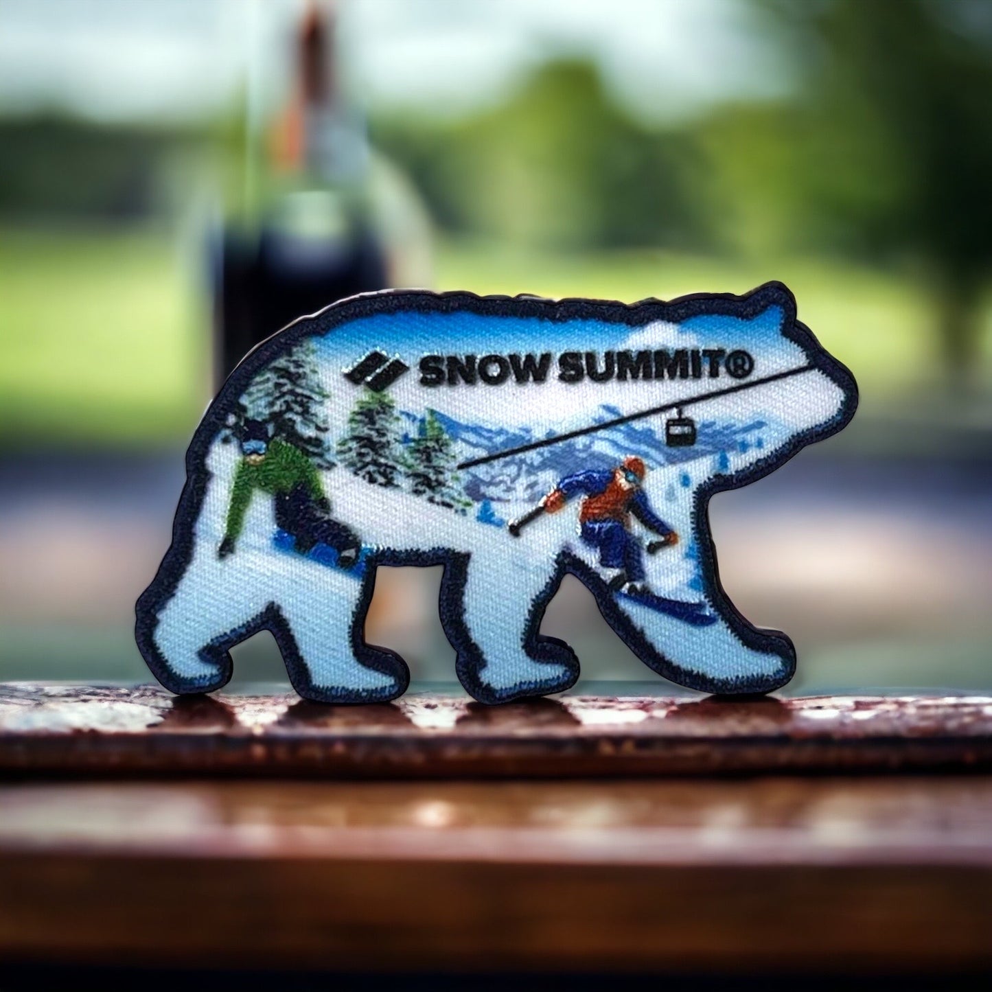 Snow summit patch with blue coloring on it with bear mountain written on it