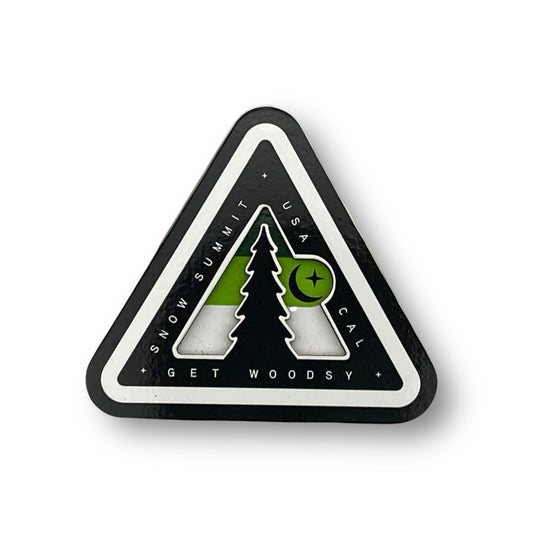Woodsy logo on a magnet with green coloring