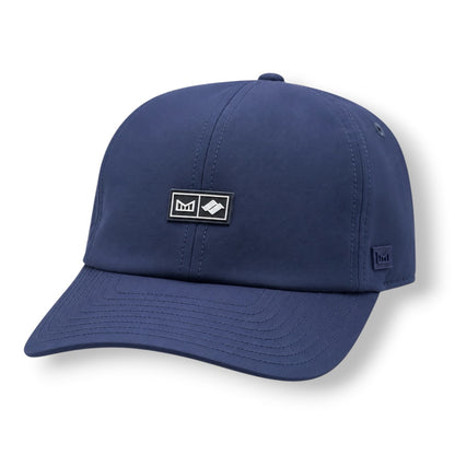 The frontside of a navy color Melin strap hat with Snow Summit logo on front.
