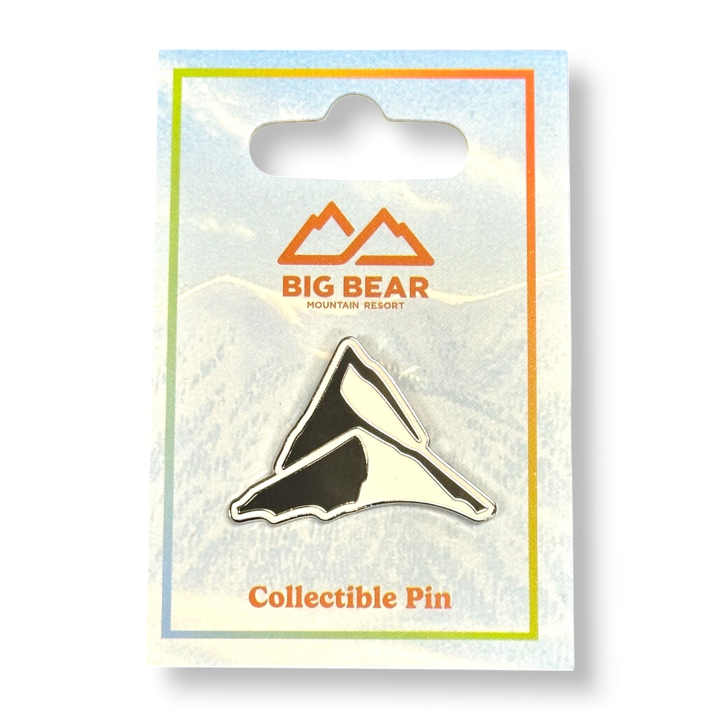 Collectible Snow Valley mountain peak pin in black and white.