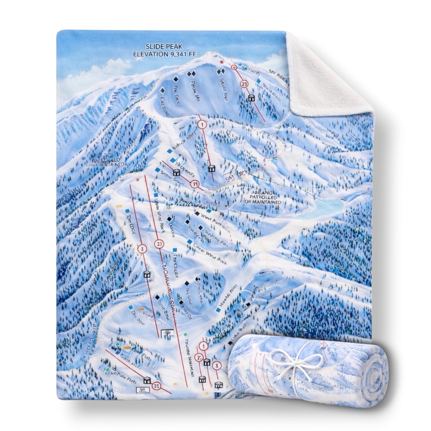 A blanket with Snow Valley's winter trail map on one side, with an opposing blank white side.