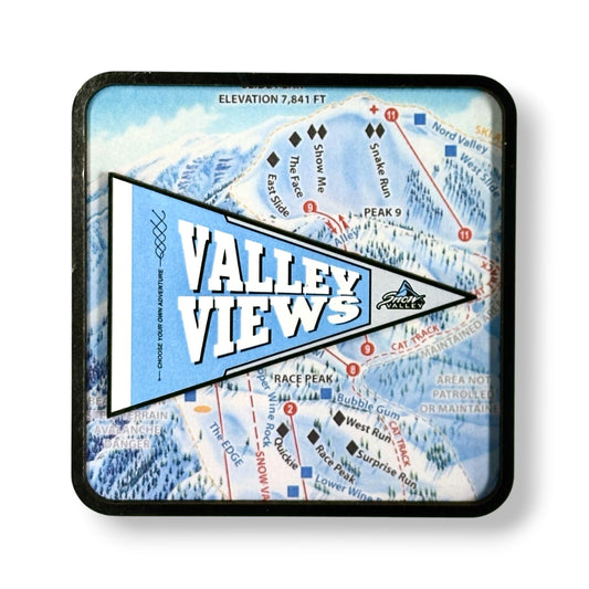 A square magnet with rounded corners featuring a ski resort map background and a large blue pennant reading 'VALLEY VIEWS' with a mountain graphic. The coaster has a black border and is shown on a white background with a soft drop shadow.