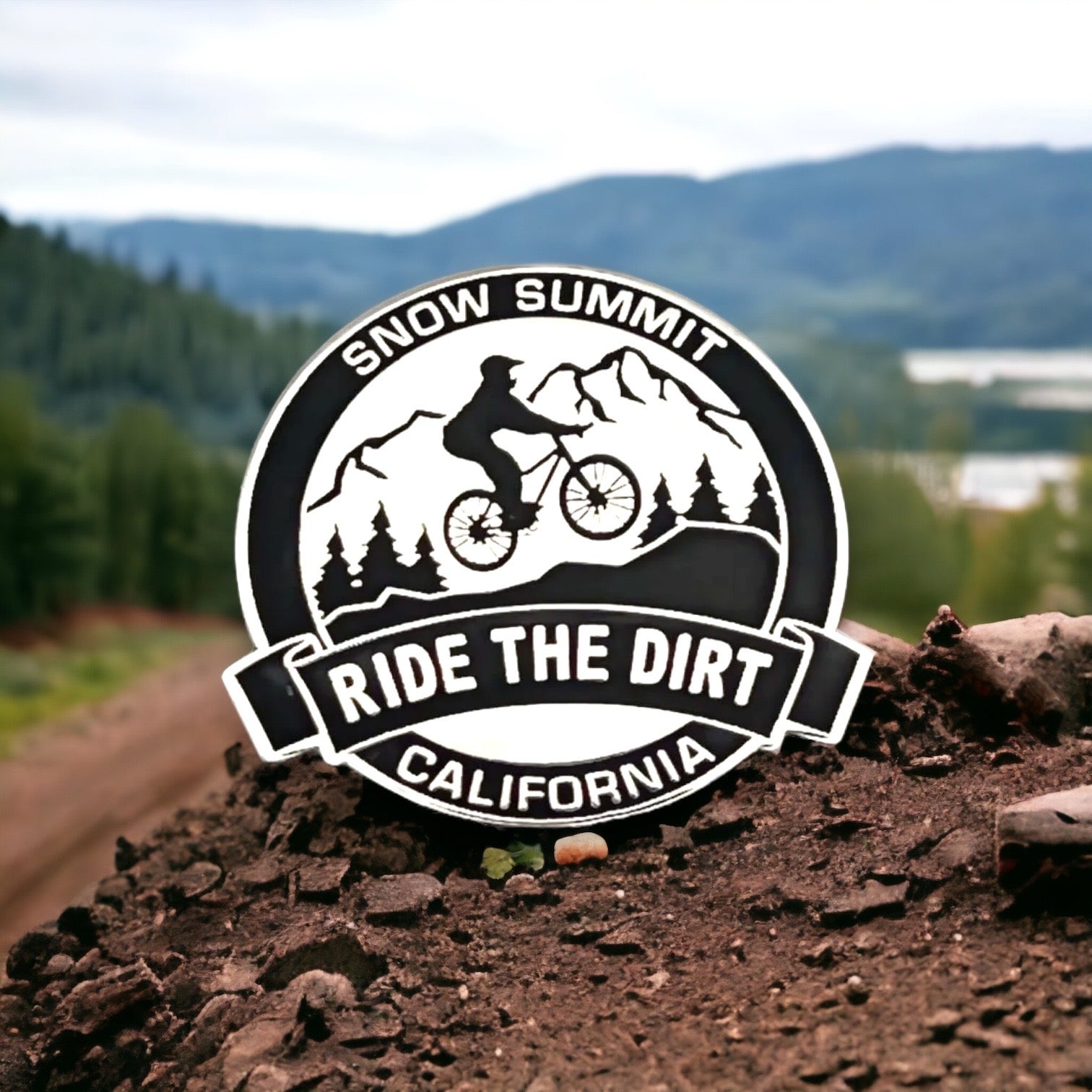 Snow Summit Ride the Dirt Pin black and white with a mountain bikers on it