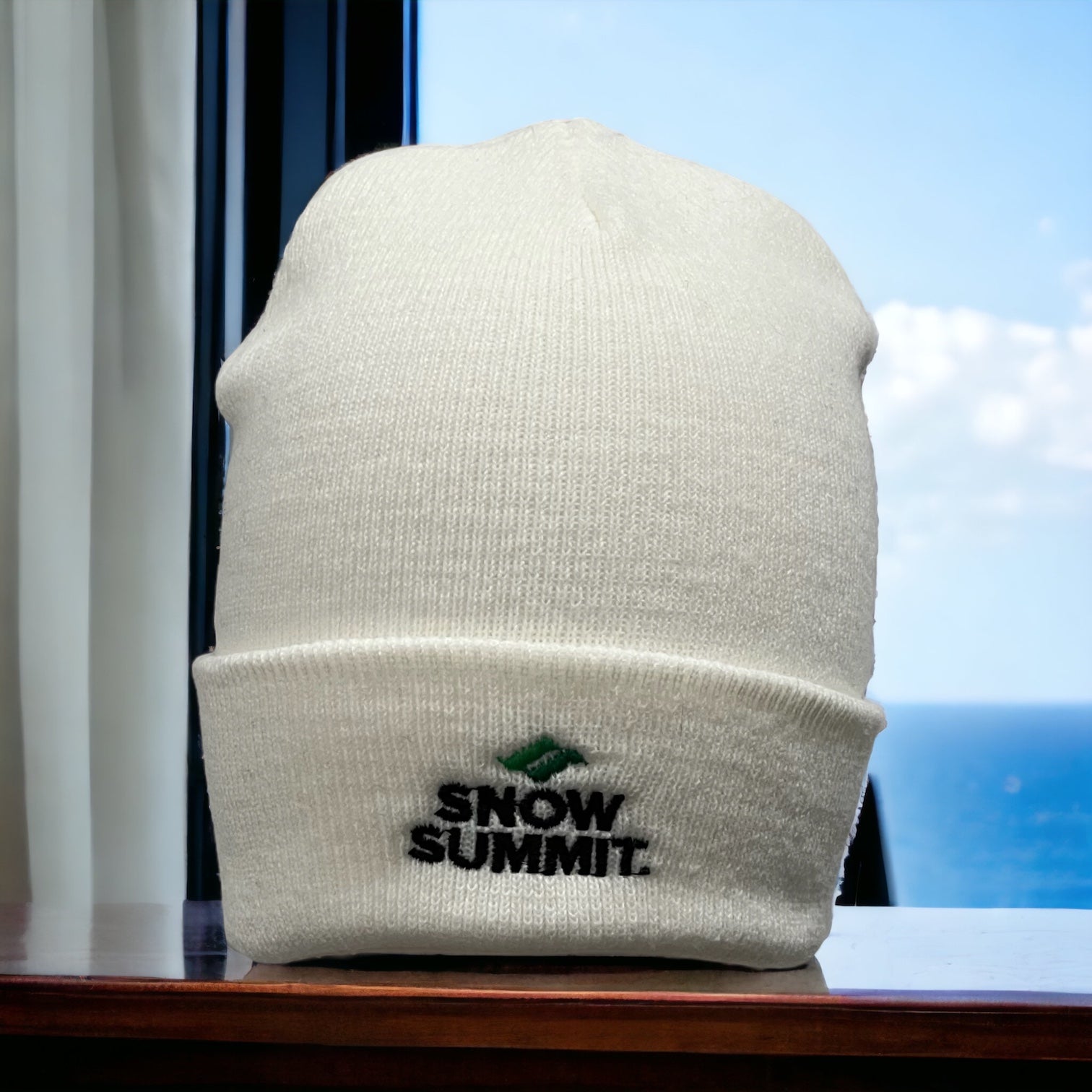 white beanie with folded brim and snow summit logo