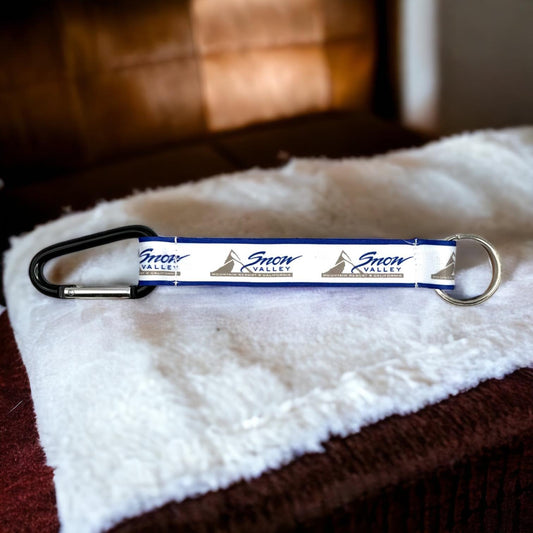 Snow Valley Logo strap keychain with carabiner on one end and keychain on the other.