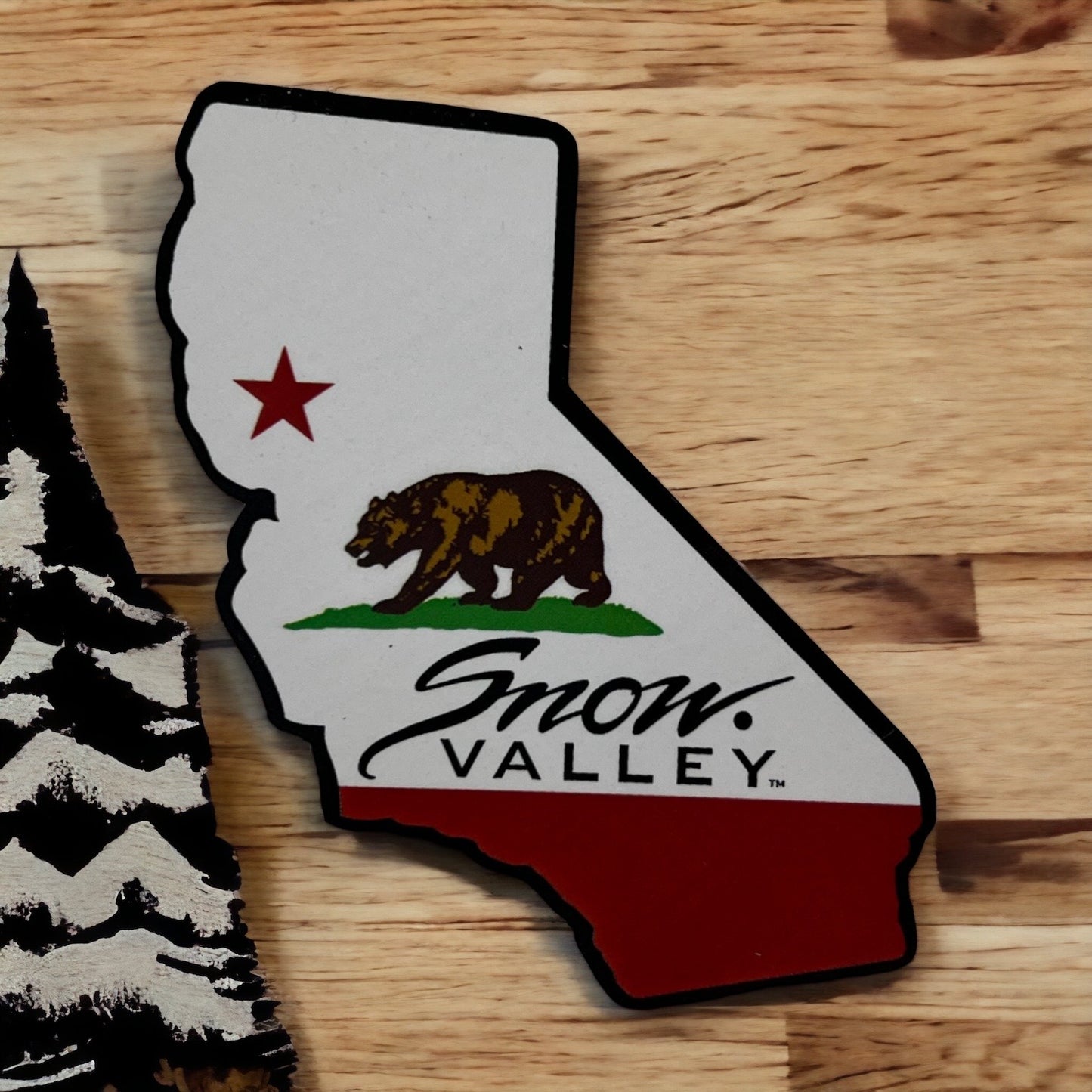 California shaped magnet with Snow Valley logo and bear