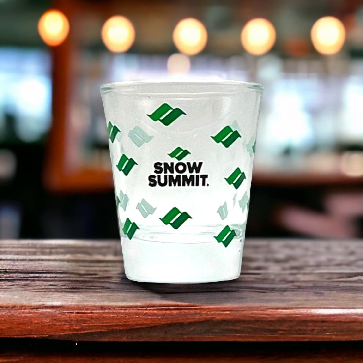 Shot glass with snow summit logo printed around it