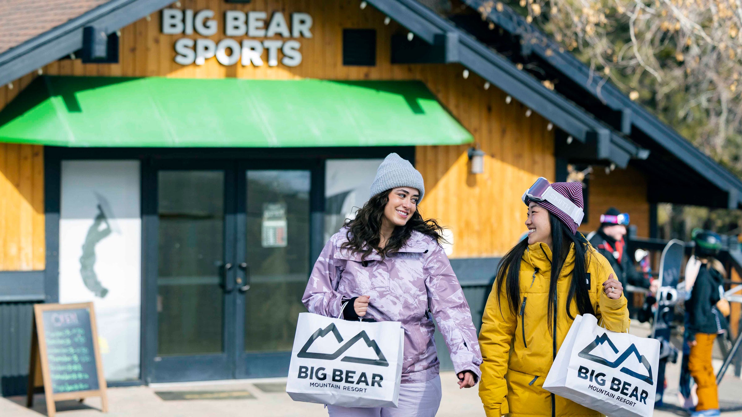 Big Bear Sports retail store with guests carrying bags